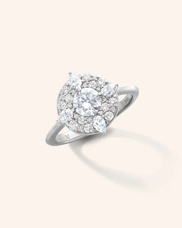 “Points North” Diamond 18K White Gold Ring with Round and Pear Shaped Diamonds