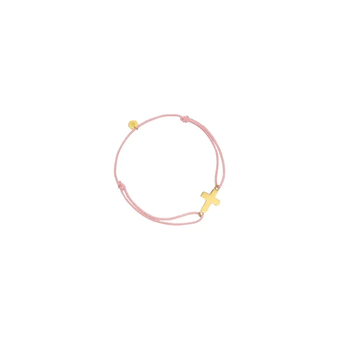 Arthus Bertrand Baby Cross bracelet in yellow gold on a pink cord | LEPAGE