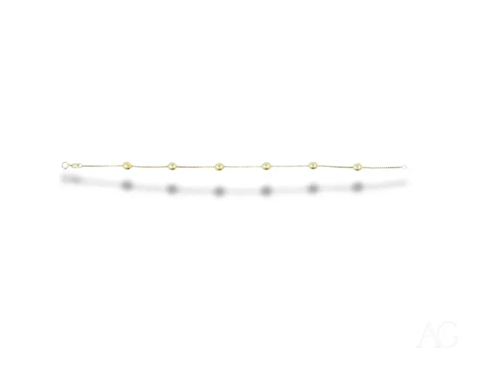 Delicate 18k gold bracelet with polished gold spheres